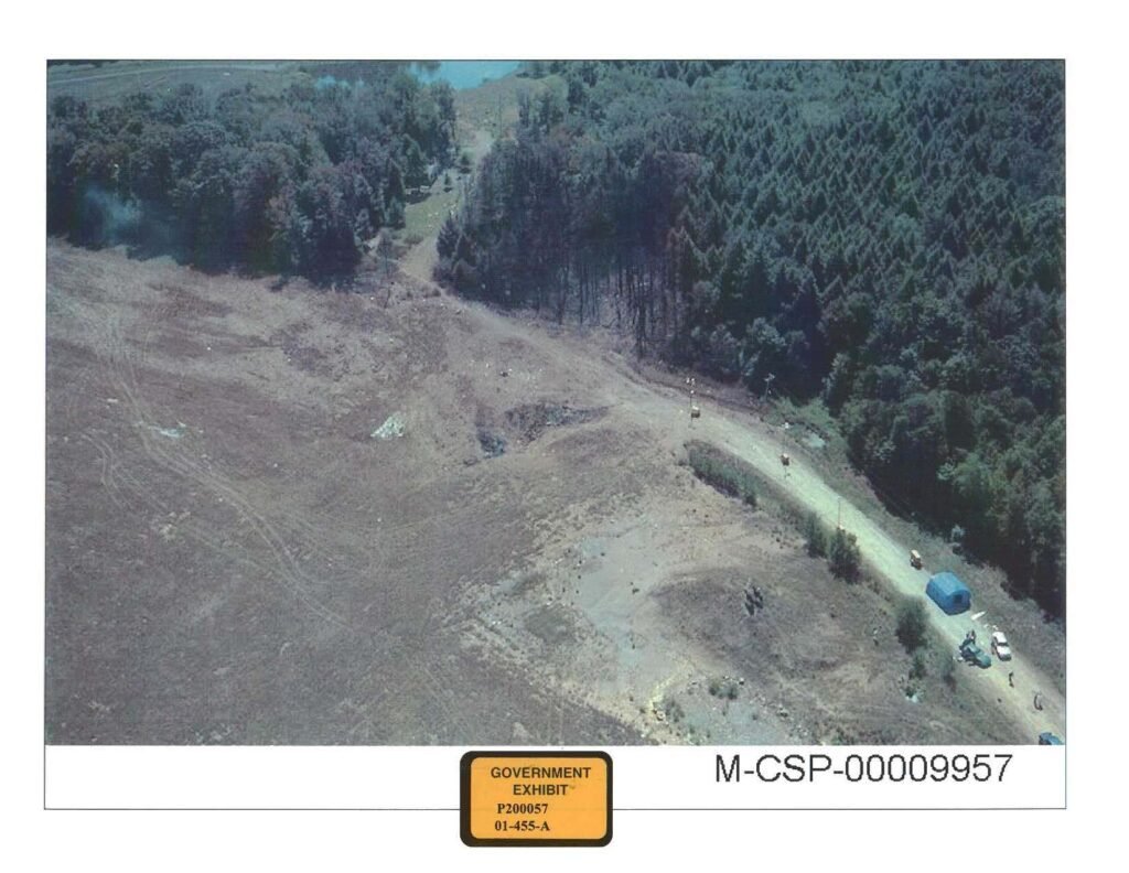 Aerial view of the Flight 93 impact crater and surrounding field, photographed by National Park Service investigators during the early crash site investigation.