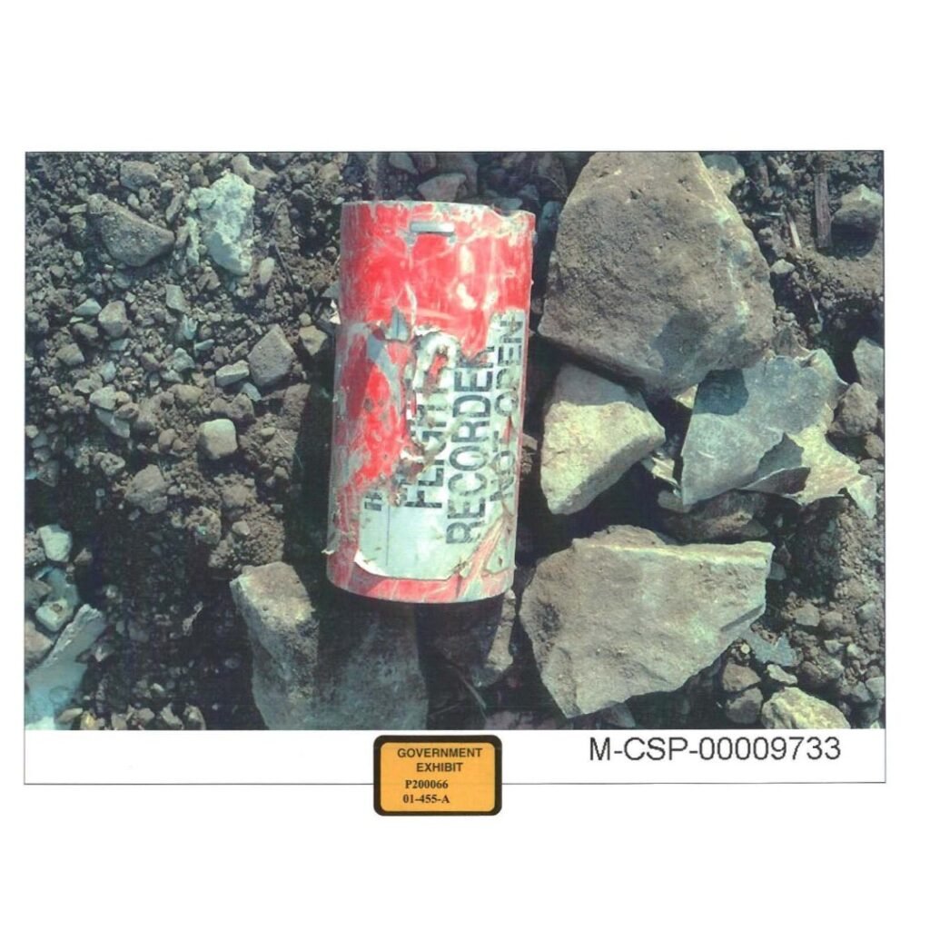 Close‑up view of the recovered Flight 93 flight recorder, photographed by National Park Service investigators during the early crash site investigation.