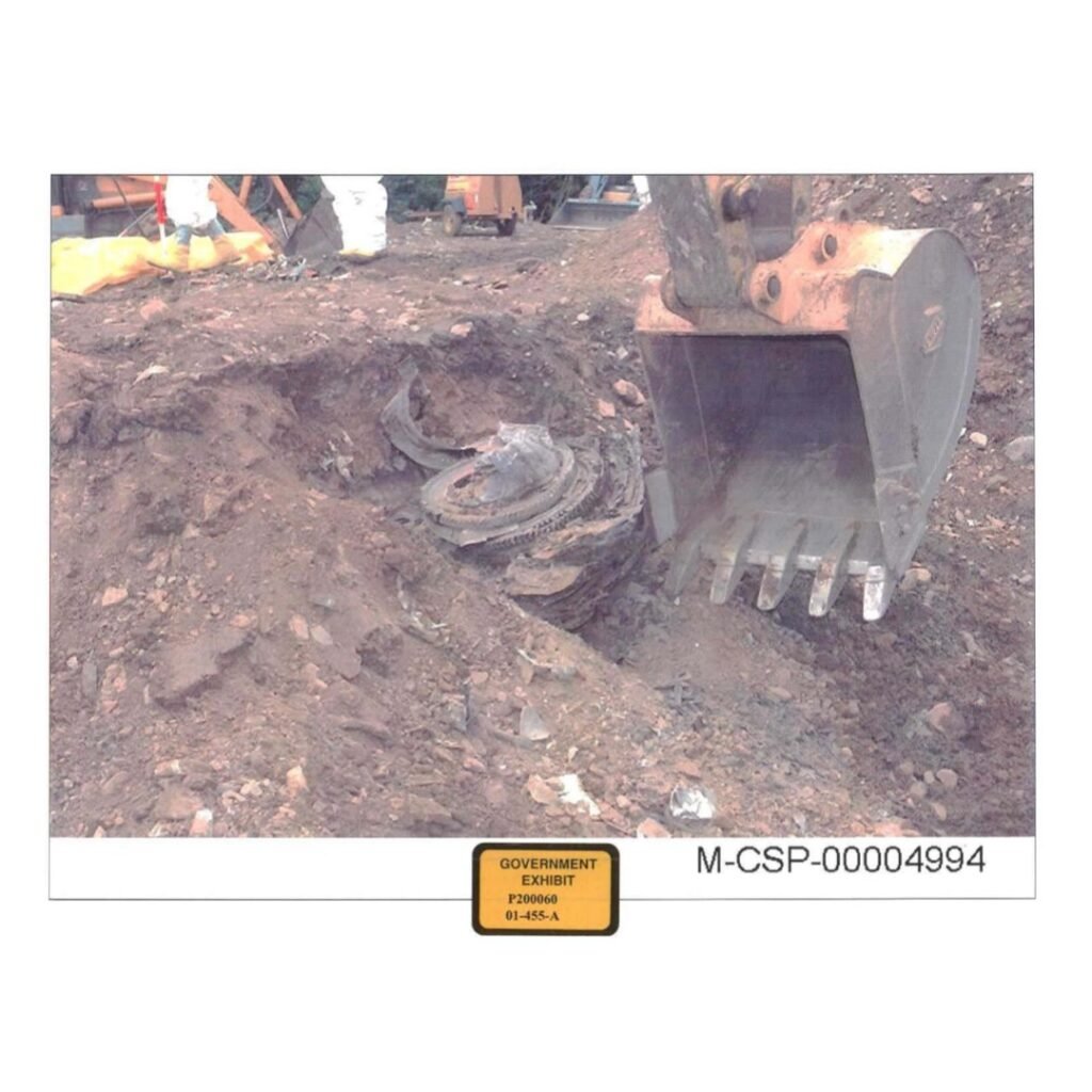 Recovered engine from Flight 93 still embedded in the ground, photographed by National Park Service investigators during the early crash site investigation.