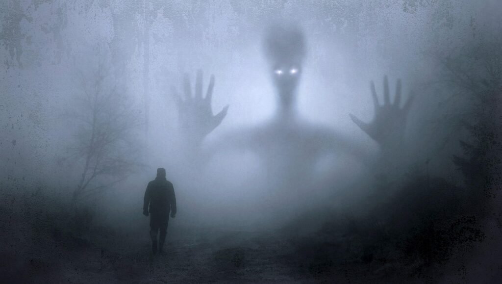 Haunted Places in Pennsylvania with a man walking towards a ghostly image
