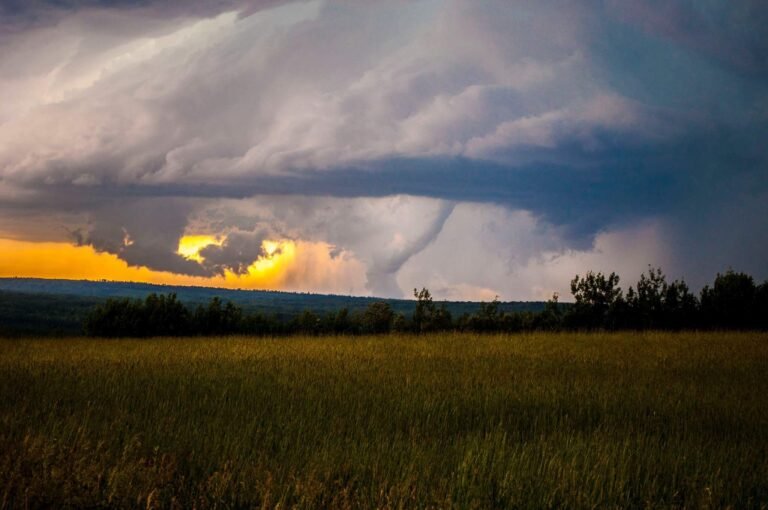 image showing a tornado over a field